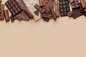 Different chocolate on color background