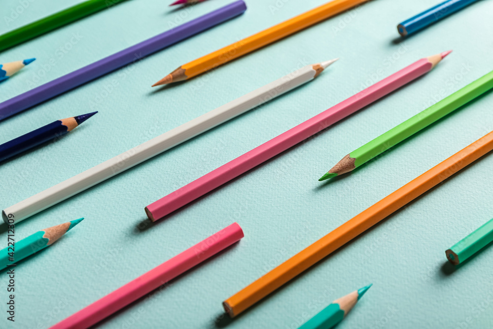 Set of colorful pencils on color background