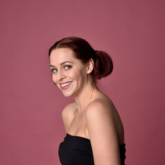 Poster - close up portrait of red haired women with different facial expressions on a pink studio background.