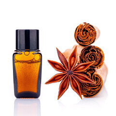 Wall Mural - Cinnamon essential oil bottle with Ceylon cinnamon sticks and anise star isolated on white background .