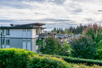 Poster - Top of residential building on cloudy sky background