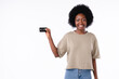 African-american charming girl holding a credit card isolated over white background
