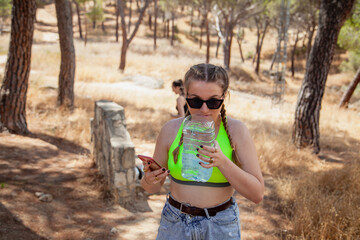 San martin de Valdeiglesias, Madrid, Spain. Happy young woman in the forest enjoying her summer vacation