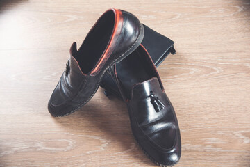 black shoes on a wooden table