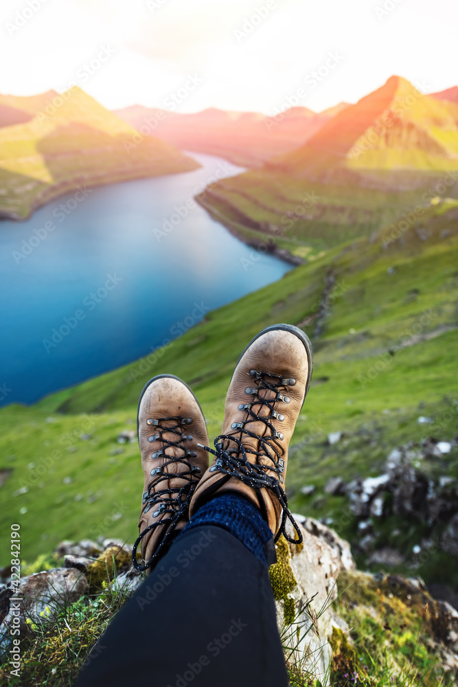 Boots of lonely tourist over majestic fjords of Funningur - obrazy, fototapety, plakaty 