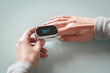 © Volodymyr Herasymov - Female patient hand measuring oxygen saturation and pulse using portable oximeter.