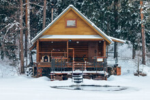 Russian Sauna Banya House In Winter Forest Nearby The Lake With Ice-hole