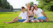© JackF - Portrait of cheerful family of four people in the park. High quality photo