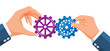 © absent84 - Businessman hands joining two gears together.