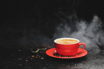 Cup with hot coffee on dark background