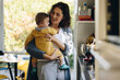 © Jacob Lund - Mother with baby in kitchen