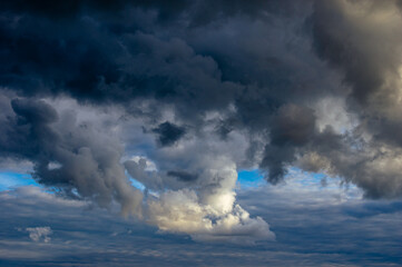 Cumulus clouds in a blue sky.