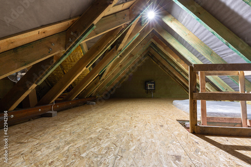 The attic of a single family house with a wooden floor