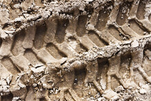 Tyre Mark Background. Tire Track Shape. Trail Lines On Dry Brown Sand Pattern. Road Construction Site Backdrop. Heavy Machinery Imprint. Dried Mud Vehicle Wheel Shape.