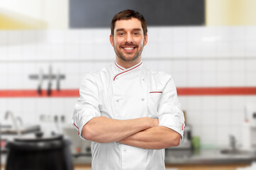 Wall Mural - happy smiling male chef with crossed arms