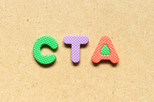 Foam Alphabet Letter In Word CTA (Abbreviation Of Call To Action Or Chartered Tax Adviser) On Wood Background