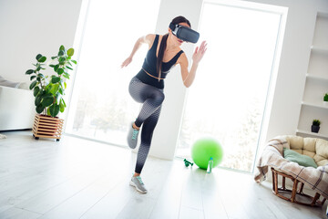 Poster - Full size photo of young serious beautiful athlete woman running fast speed exercising in vr glasses at home house