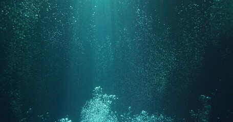 sunbeams and bubbles underwater