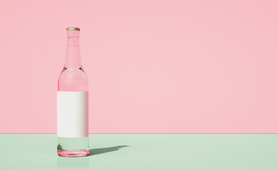 Leinwandbilder - Glass beer bottle on horizontally divided bi-color retro pastel pink and green color background.