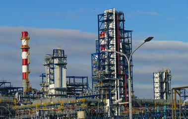 Corps of Moscow refinery in spring in clear weather