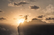 © kieferpix - Strong man flexing on top of a mountain reaching his goals. Sport motivation, and winning concept.