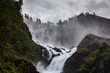 © Josu Torrealday/ADDICTIVE STOCK - Spectacular landscape of rapid river streaming between rough rocks in mountains of Norway on cloudy day