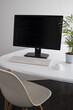 © Ramon Lopez/ADDICTIVE STOCK - Modern computer with black monitor and white keyboard placed on desk with potted green plant in office
