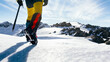 © Sergio Victor Vega/ADDICTIVE STOCK - Back view of crop anonymous mountaineer in boots with crampons climbing snowy mountain slope in sunny day in highlands