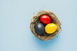 easter eggs red, yellow and black as german or belgium flag colors. Happy Easter holiday  nest card