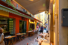 View Of One Of The Many Narrow Alleys Filled With Cafes And Shops In The Historic Old Town Area Of Vieux Nice, France, On The French Riviera.