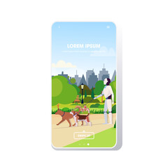 Poster - modern robot walking with dogs artificial intelligence technology concept public park cityscape background smartphone screen mobile app copy space full length
