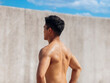 © Tom Wang - Rear view of muscular athletic young man