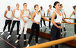 © JackF - Group of people doing ballet exercises using barre in dance .school