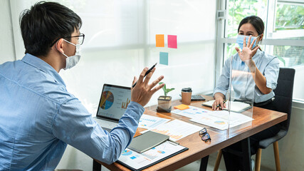 Aufkleber - Two business colleagues wearing face mask to brainstorming business project and giving high five to each other