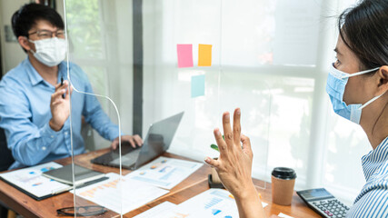 Aufkleber - Close up of two business colleagues wearing face mask to brainstorming business project and giving high five
