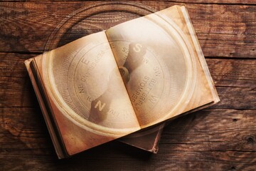 Canvas Print - Vintage open book on old wooden table