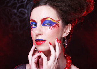 Wall Mural - Portrait of young brunette woman with artistic make-up, close up. Beauty concept.