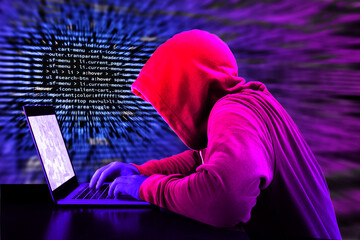 Wall Mural - Hacker in a purple hoody in front of a blue code background with binary streams and information security terms cybersecurity concept