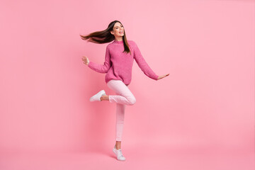 Sticker - Photo of cute adorable young woman dressed knitted smiling dancing isolated pink color background