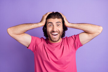 Wall Mural - Photo of shocked funny young guy dressed pink outfit arms head isolated purple color background