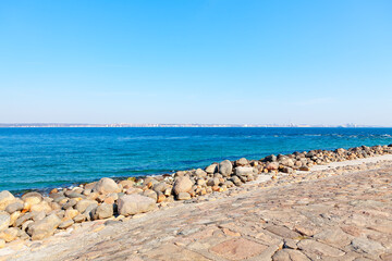 Seaside boulders and berth balustrade . Stones on the Baltic Sea coast 