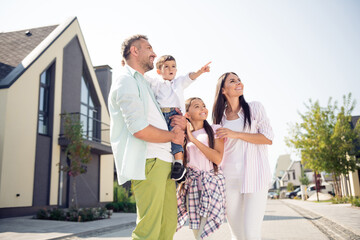 Sticker - Profile portrait of big positive family boy indicate finger far away look interested have good mood walk outdoors