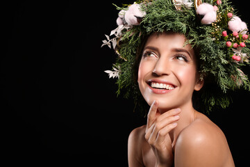 Poster - Happy young woman wearing wreath on black background. Space for text