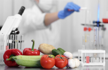 Wall Mural - fresh vegetables on table in laboratory. food quality control