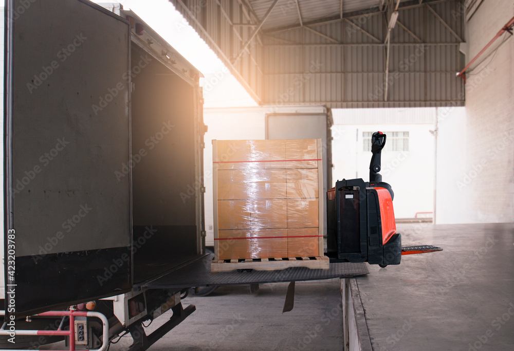 Electric Forklift Pallet Jack Loading Package Boxes into Cargo ...