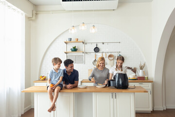 Caucasian family Cooking breakfast with the air fryer together at home