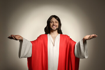 Poster - Jesus Christ reaching out his hands on beige background