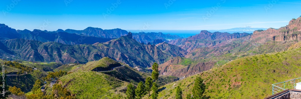 Pico de Teide viewed behind mountainous landscape of Gran Canaria, Canary Islands, Spain. - obrazy, fototapety, plakaty 