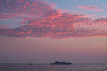 A Ship Traveling In The Horizon, Glorious Colorful Sunset Skies, Calm Low Tide Ocean Shore, View From The Famous Galle Fort.