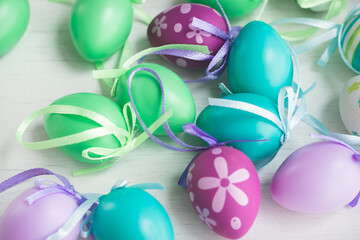  Pastel color plastic Easter eggs decoration on a light background